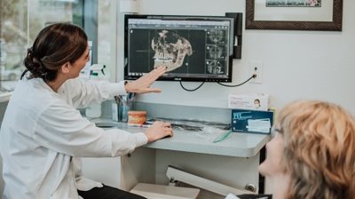 Dr. Sarkaria reviewing a CBCT Photo